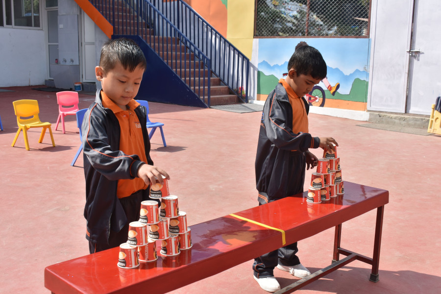 2 boys playing cup stacking sports