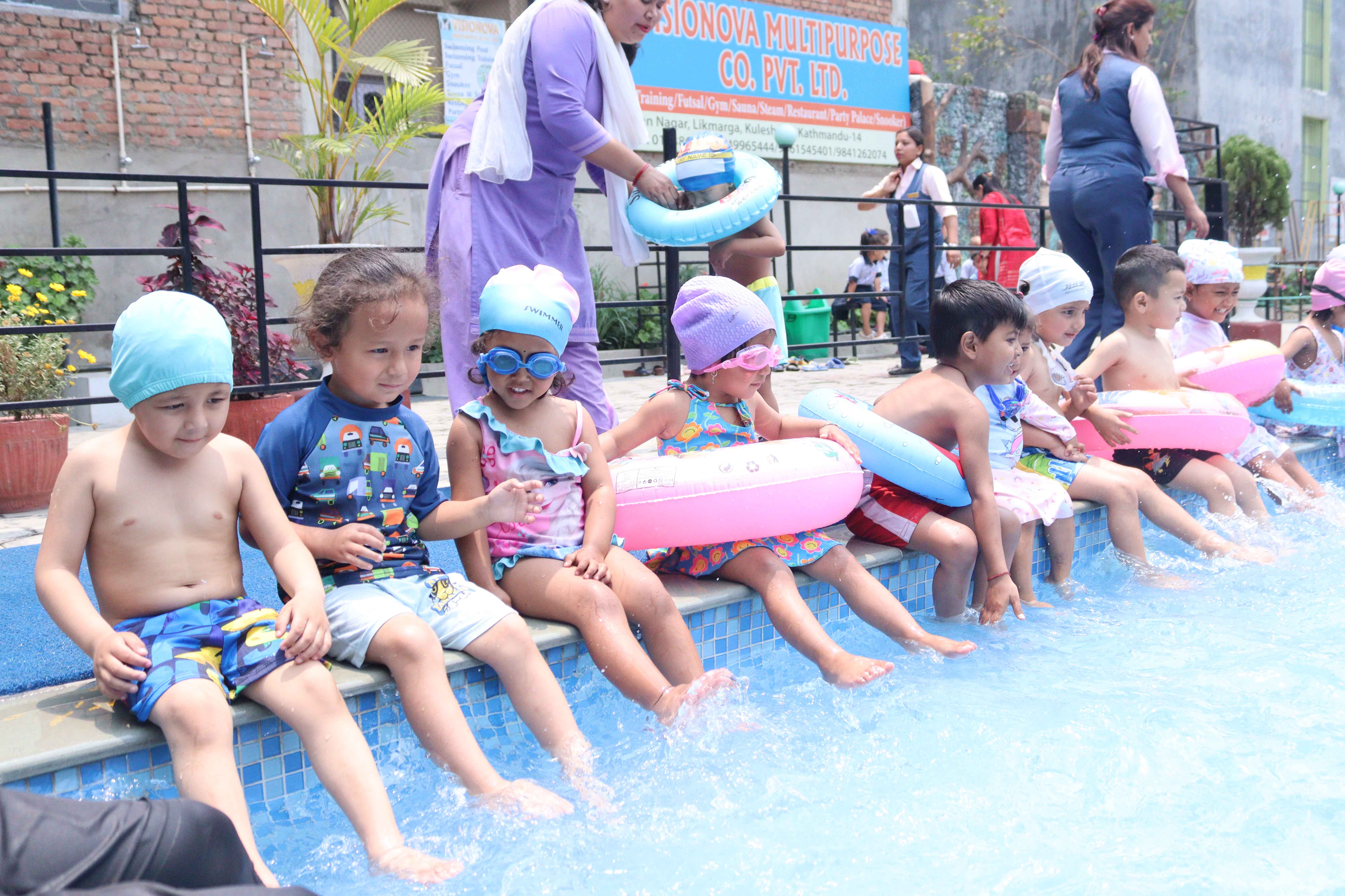 children are playing in water