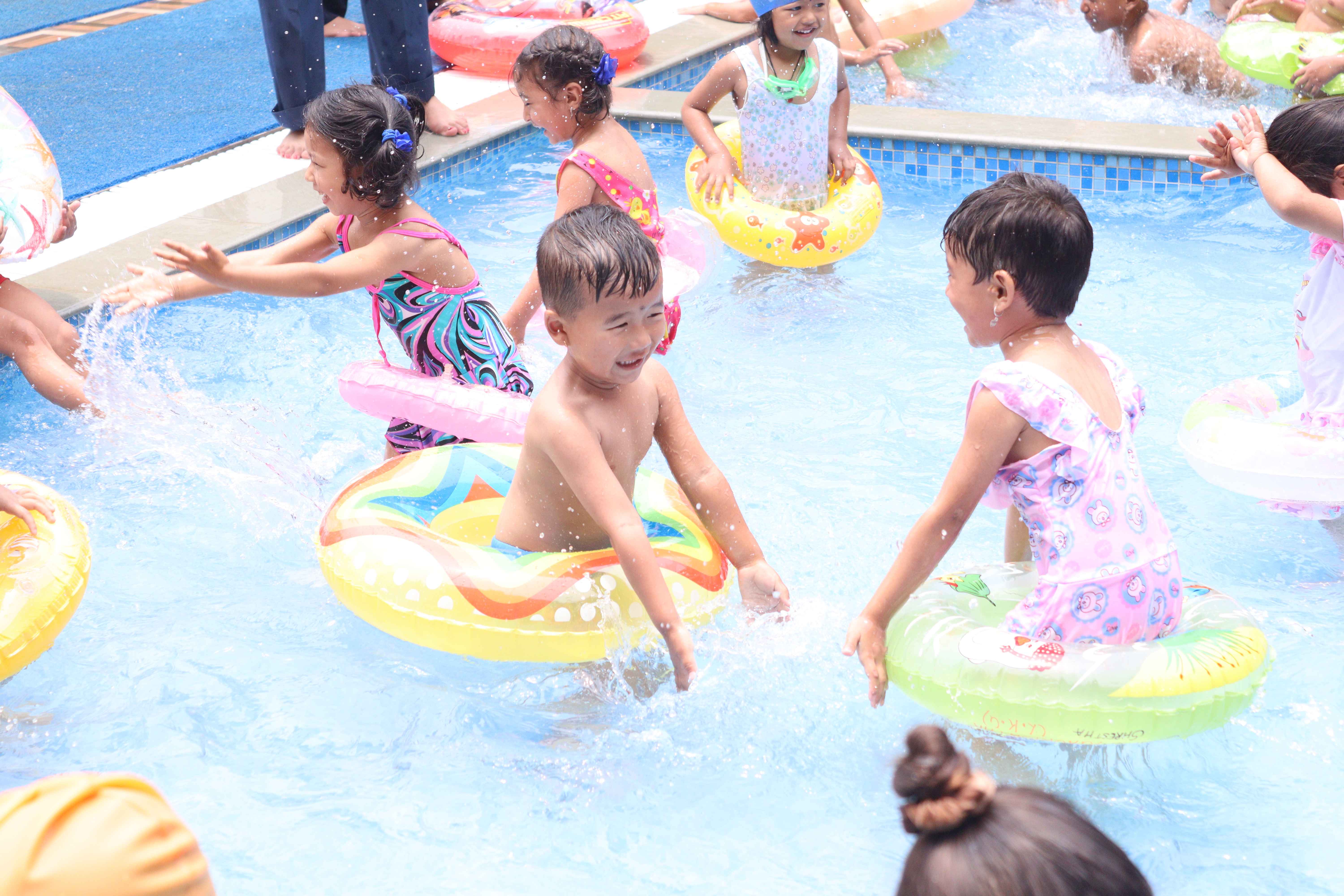 preschool students are swimming