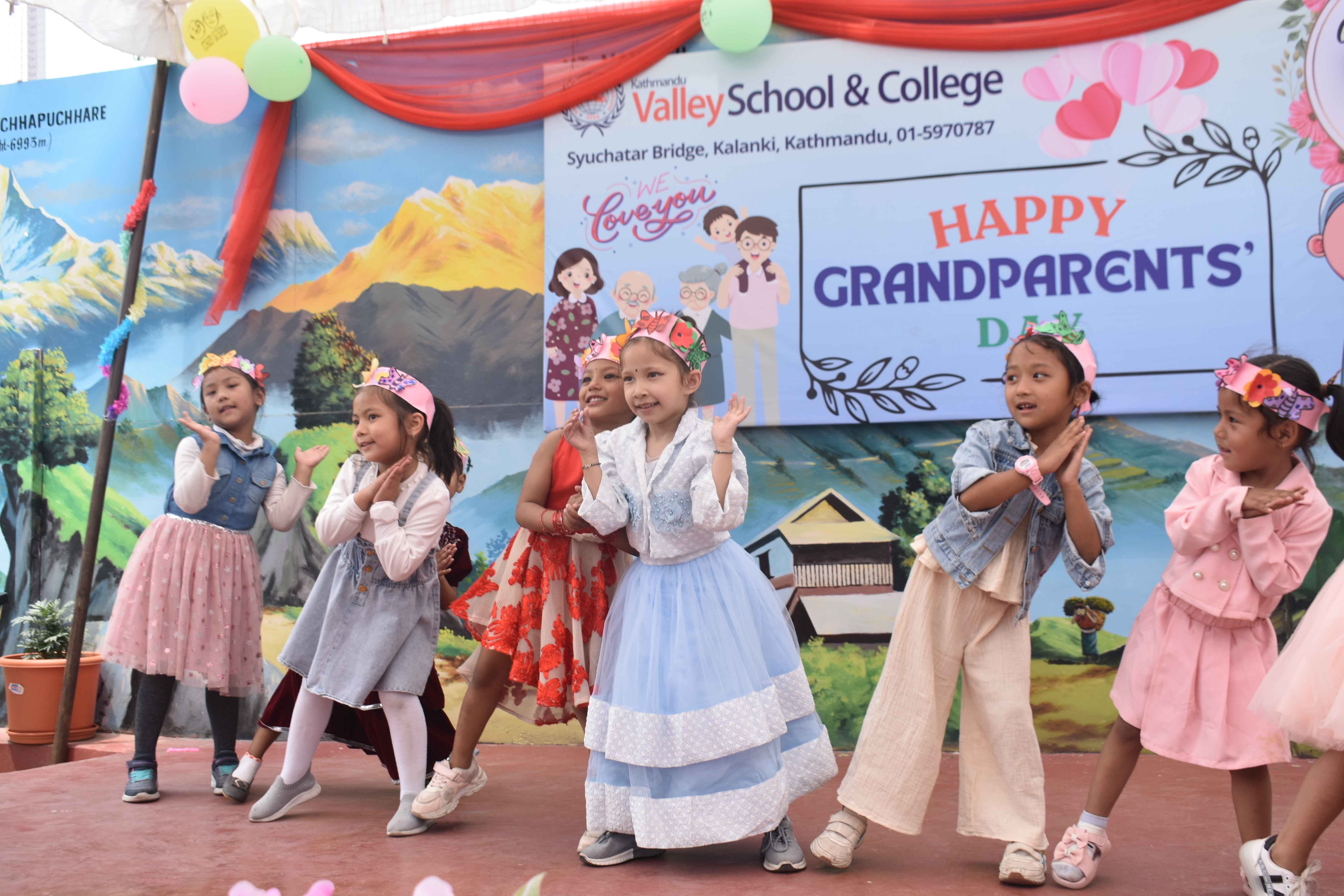 Students perform on stage on grandparents day