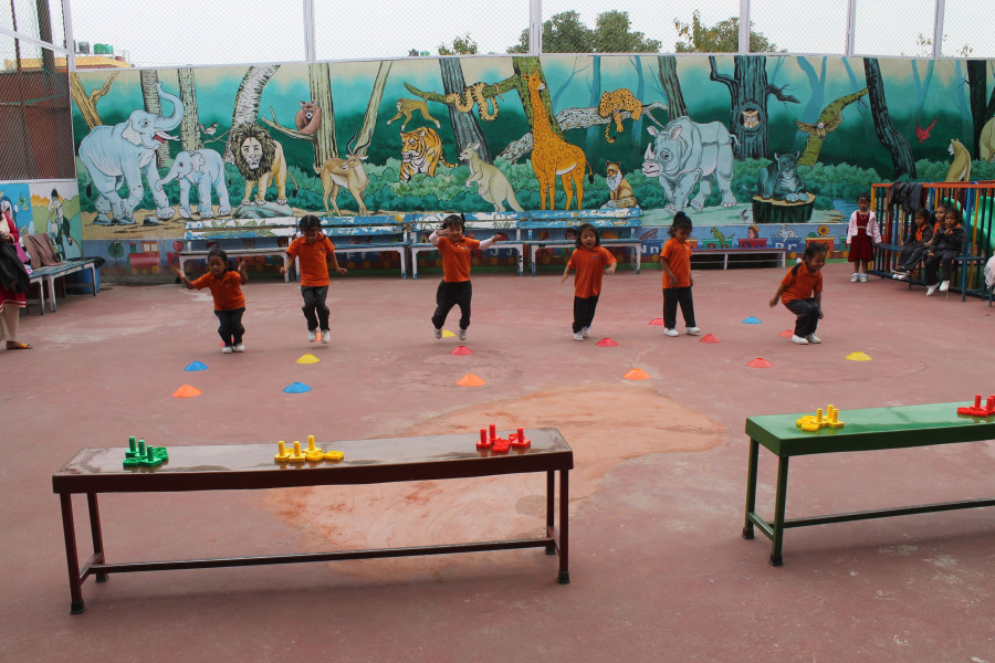 Small students are playing game in school