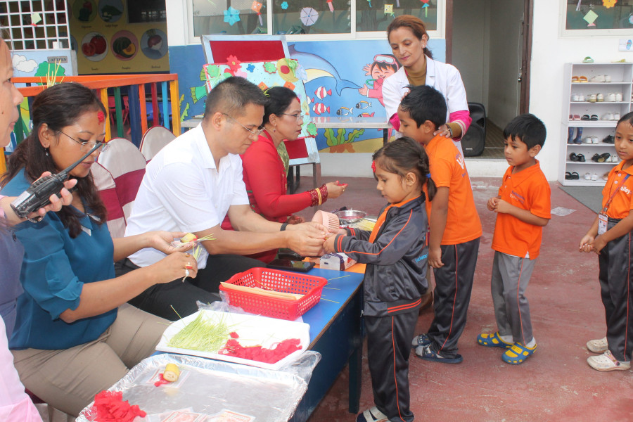 Students celebrating Dashain with traditional activities at school