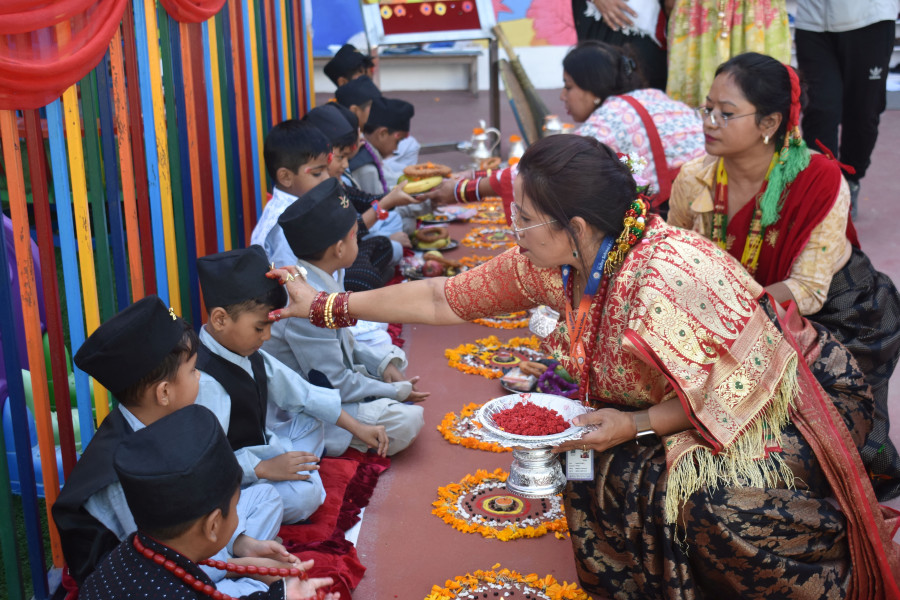 teacher put tika on students forehead in tihar