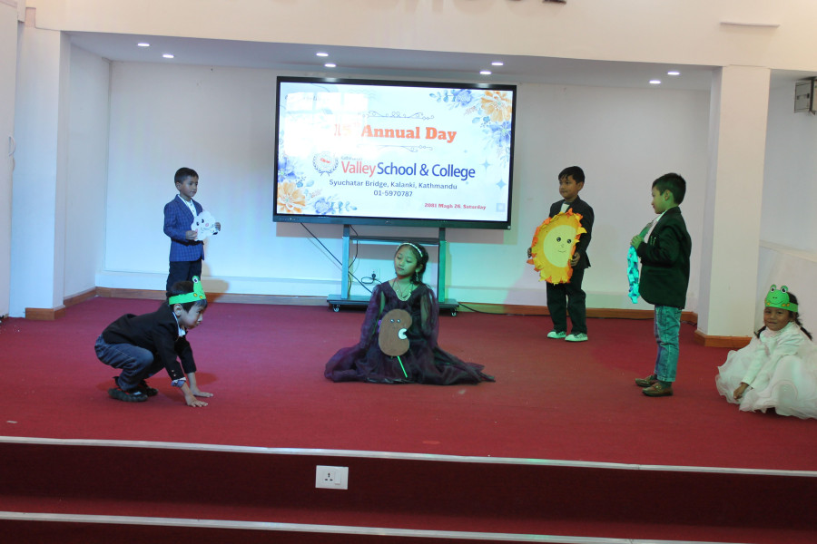 Happy preschool children presenting cultural performance on school stage