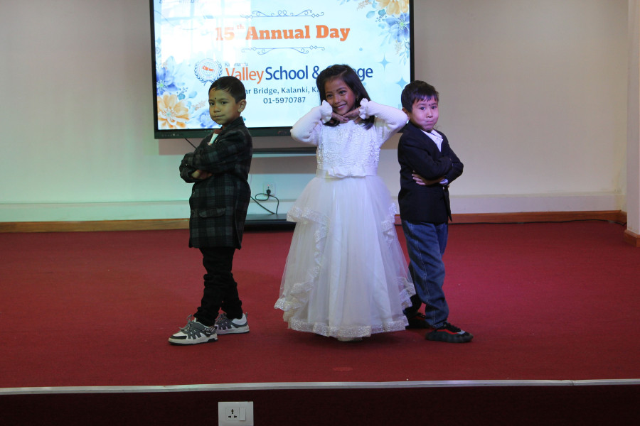 Small children performing dance on stage at annual day program